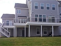 <b>Trex Composite deck with white aluminum railing and black ballusters - wrapped beams and supports</b>
